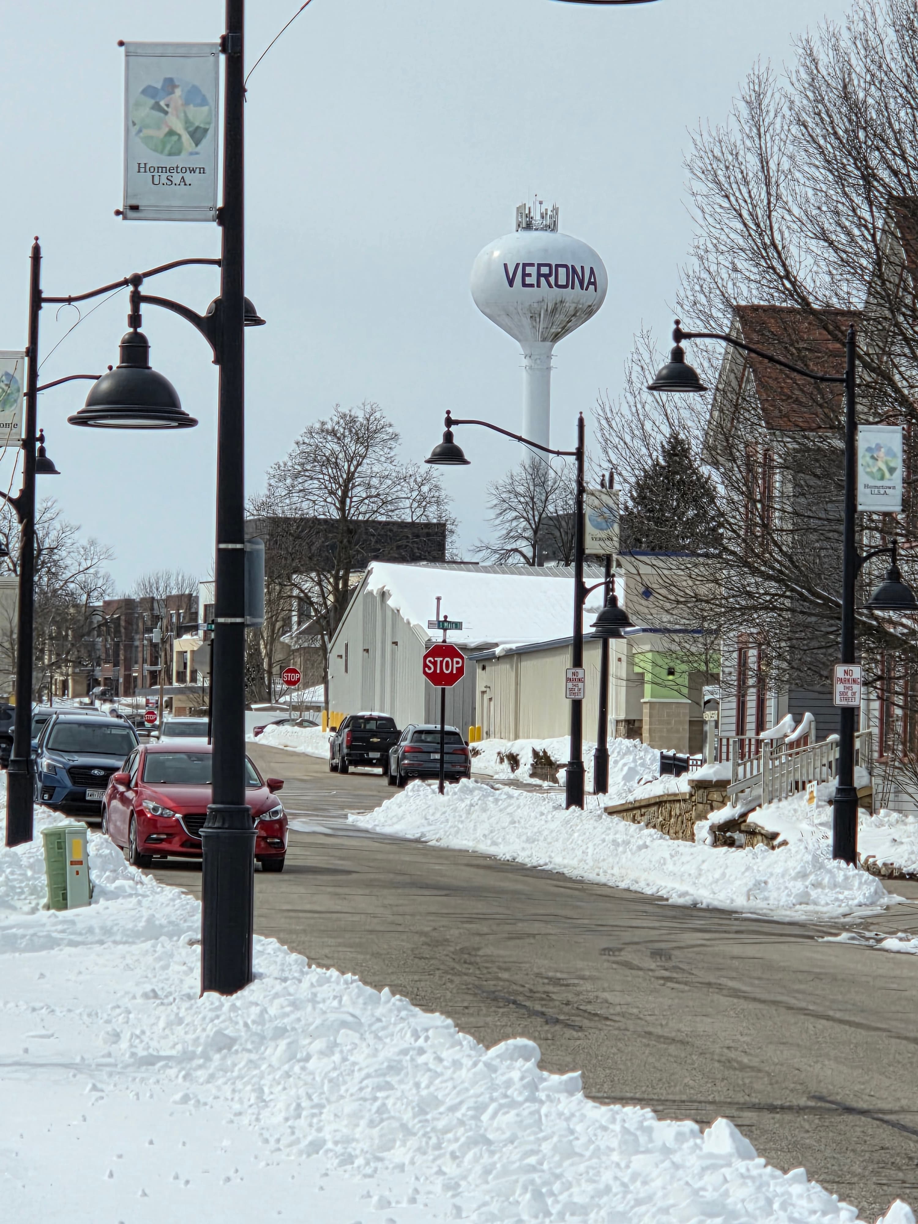 Junk removal service in Verona, WI — Hometown USA downtown with iconic water tower and Main Street