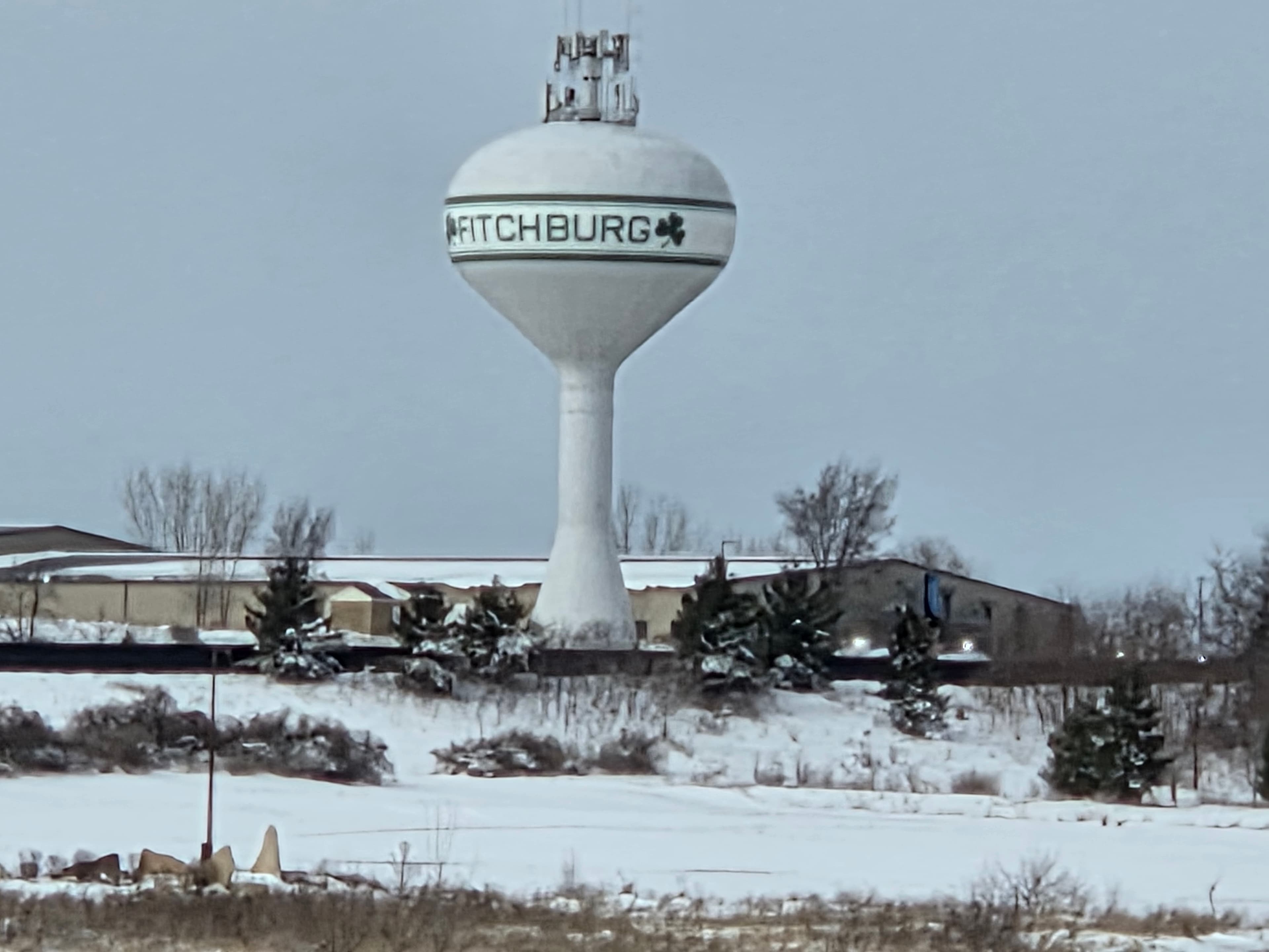Junk removal service in Fitchburg, WI — Iconic water tower with shamrock serving south Madison area