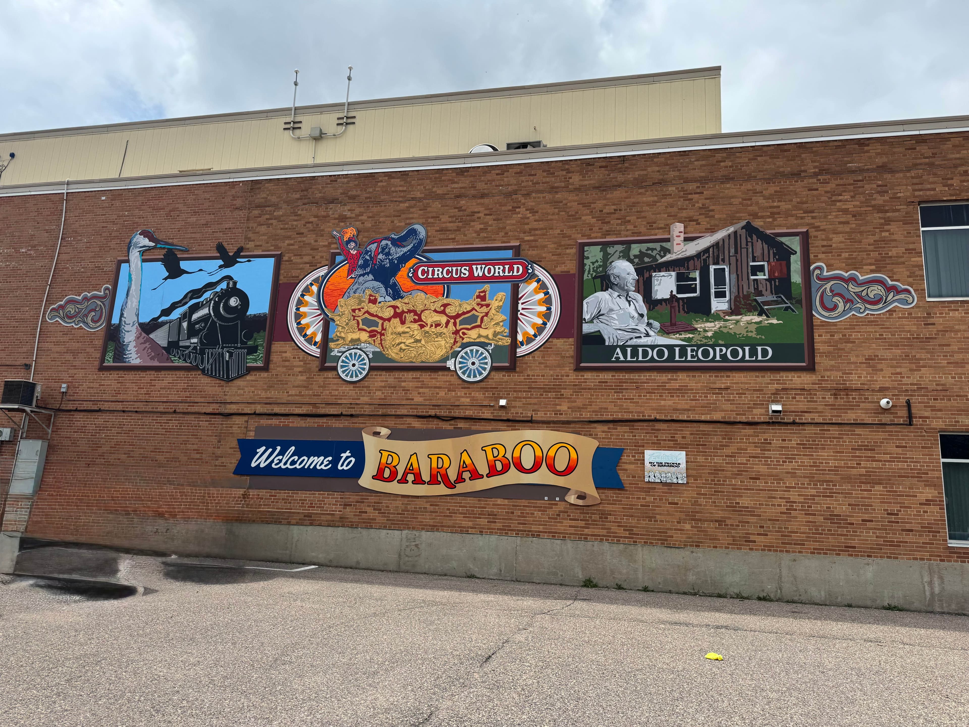 Junk removal in Baraboo, WI — Welcome to Baraboo sign with historic murals