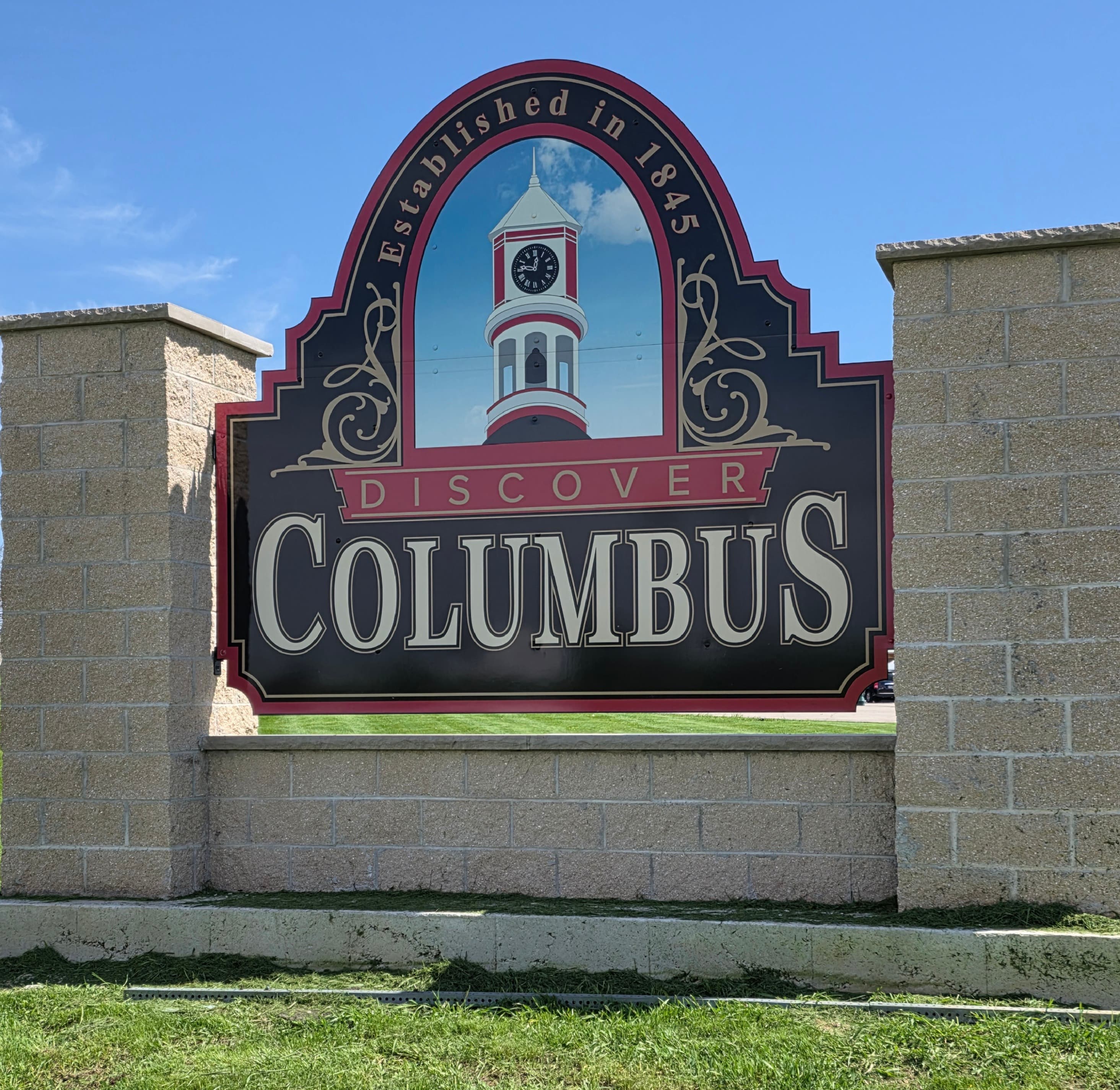 Junk removal in Columbus, WI — historic Columbus welcome sign established 1845