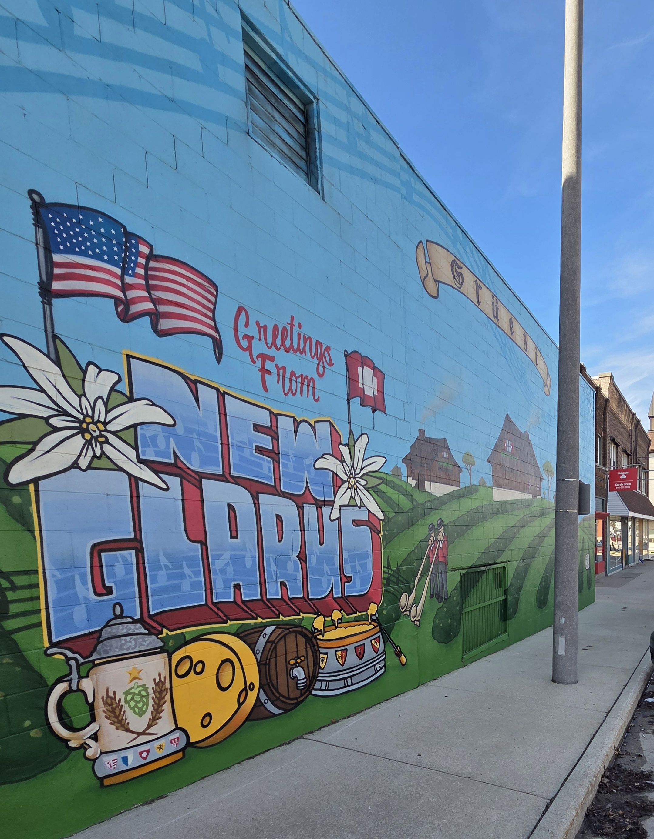 Downtown New Glarus mural with Swiss heritage imagery