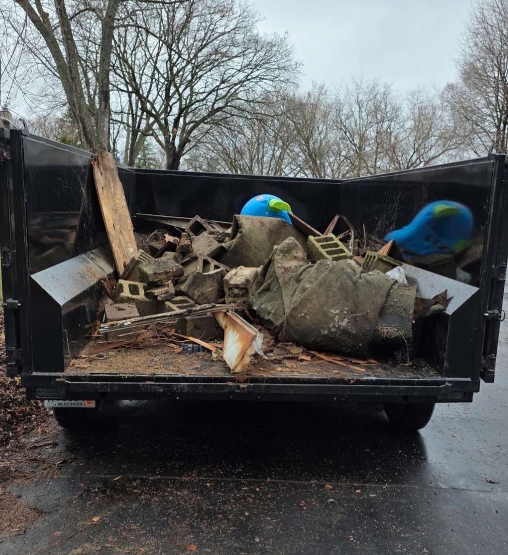 The Cleanout Company junk removal trailer — full load example